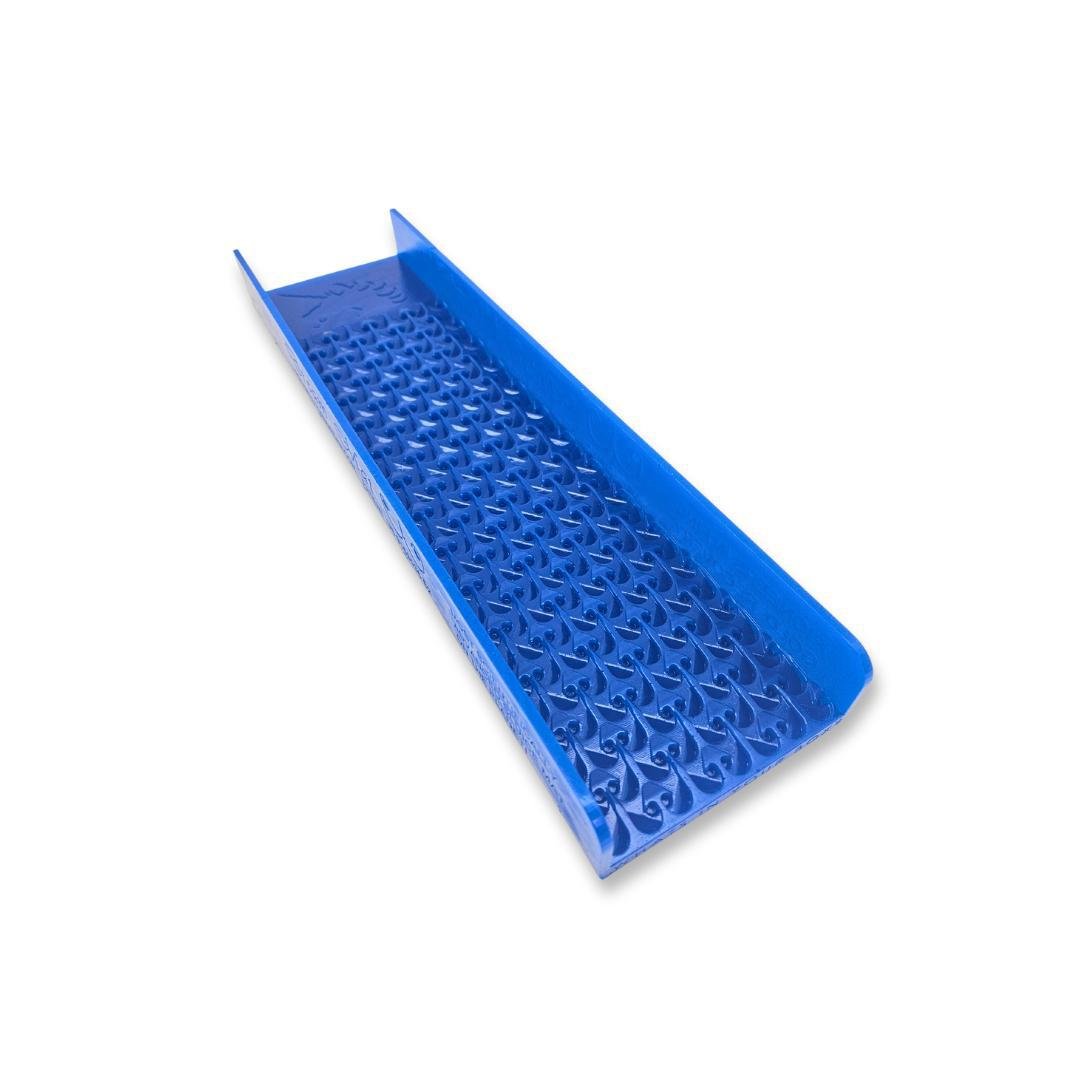 Blue plastic sluice box with raised riffles and textured bottom for gold prospecting.