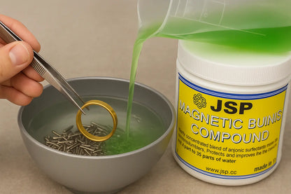 Gold ring held over a magnetic pin finishing bowl while green JSP polishing solution is poured in