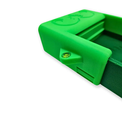 Close-up of green 4X16 Adventure Sluice Box with Header Box Kit showcasing bubble level on white background