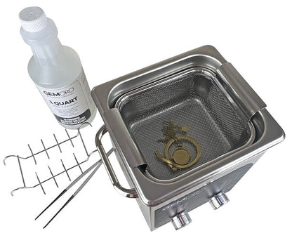 Angled view of 2-quart ultrasonic cleaner with heater and accessories, basket, solution bottle, and tools on white background