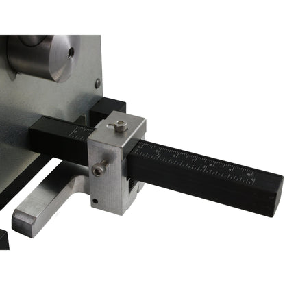 Close-up of 4-inch guillotine shear showcasing measurement ruler with inch markings on white background