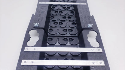 Close-up of the black 6X22 Expedition Sluice Box showing its Vortex Dream Mat and silver crossbars on a white background