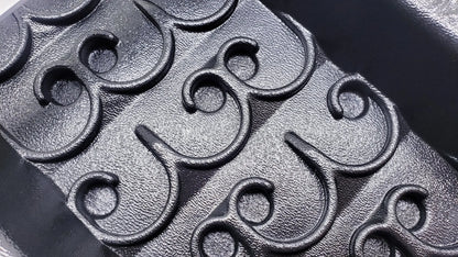 Close-up of black Vortex Dream Mat for the 6X22 Expedition Sluice Box showcasing raised swirl grooves
