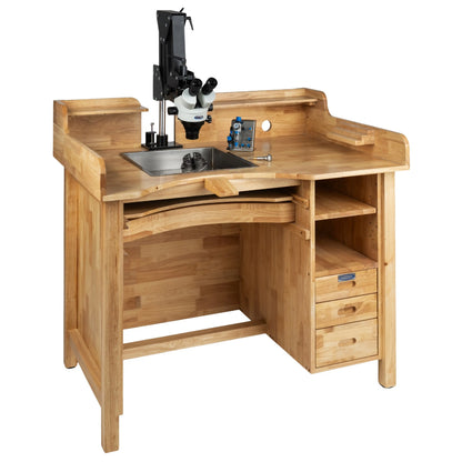 Front three-quarter view of hardwood stone setters workbench with microscope, metal work tray, drawers, and shelves on white background