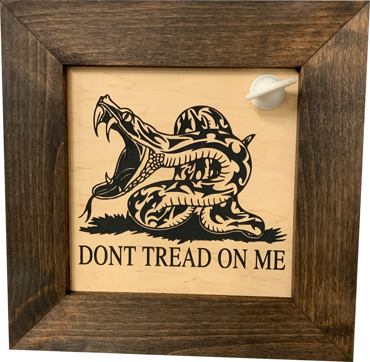 Wooden framed touchstone with black "Don't Tread on Me" snake design and white testing stone.