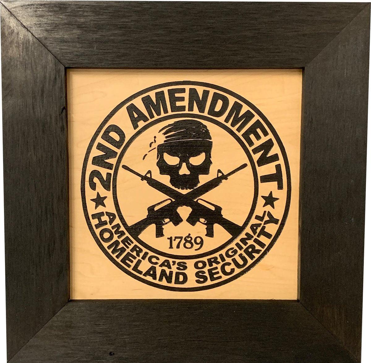 Framed wooden sign with black engraving reading "2ND AMENDMENT" and "AMERICA'S ORIGINAL HOMELAND SECURITY."