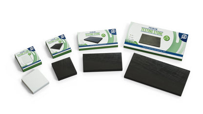Front view of four jewelry tester scratch streak stones for gold, silver, and platinum testing in black and white with packaging