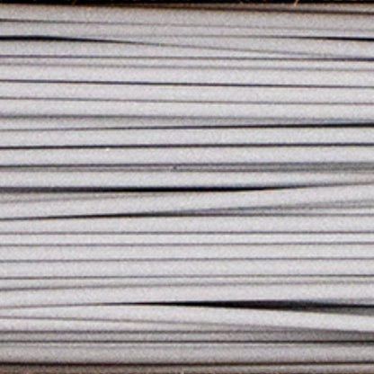 Close-up of Metal Filamet sample showcasing gray metallic filament strands on a plain background