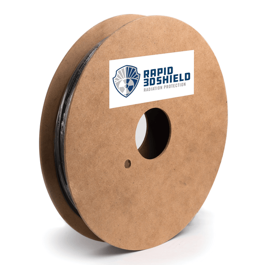 Angled view of Rapid 3DShield Tungsten 3D Printing Filament spool showing black filament and a radiation protection label