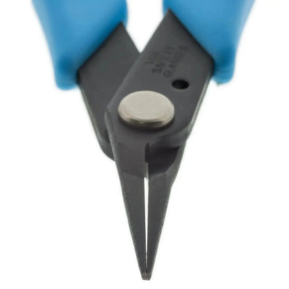 Close-up of Xuron Tweezer Nose 450 pliers showcasing pointed jaws with blue gloves on a white background