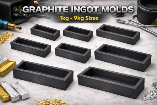 Graphite ingot molds in various sizes on a gray surface with tools and gold bars.