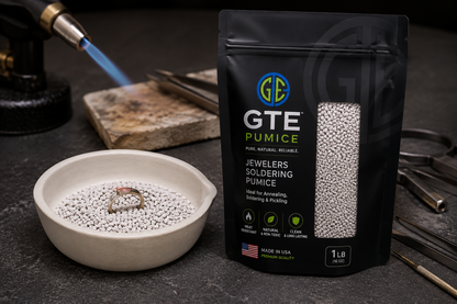 Black GTE Pumice bag with clear window showing white granules, beside a ceramic bowl with pumice and ring.