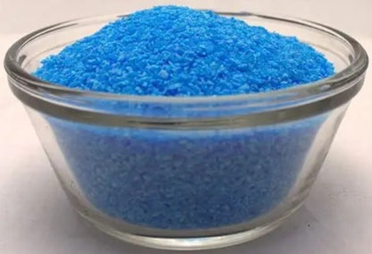 Close-up of Copper Sulfate Crystals 99 percent Pentahydrate showcasing vibrant blue crystals in a clear glass bowl on a white background