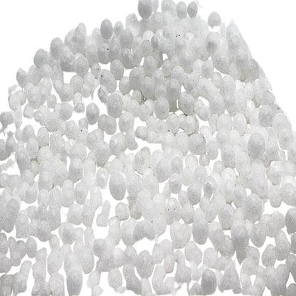 Close-up of white granules from the Gold Recovery Kit on a white background