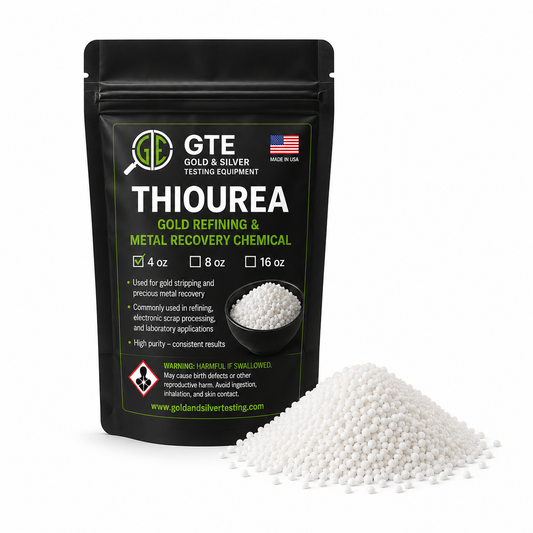 Black pouch of GTE Thiourea gold refining chemical with a pile of white spherical pellets in front.