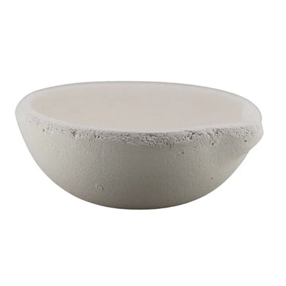 Front view of small ceramic crucible from gold melting kit with white background