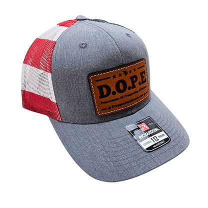 Front view of Prospectors Dream Hat showcasing gray fabric, red-and-white mesh panels, and leather DOPE patch