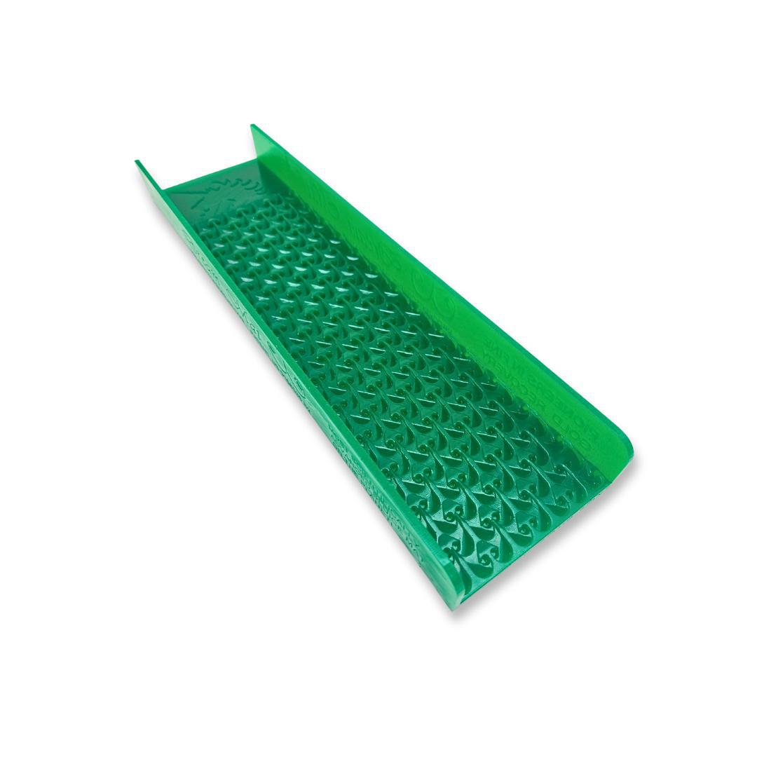 Green plastic sluice box insert with a textured riffle pattern for gold prospecting.