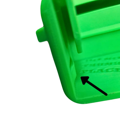 Close-up of the green 4X16 Adventure Sluice Box showcasing embossed Dream Mat branding with a white background