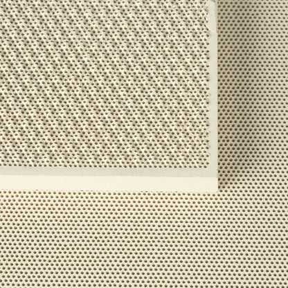 Close-up of honeycomb ceramic soldering blocks showcasing perforated surfaces with a cream-colored background