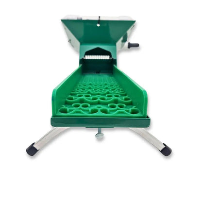 Front view of 4X16 Micro Banker with Dream Mat showcasing its green textured mat, hopper, and support legs on a white background