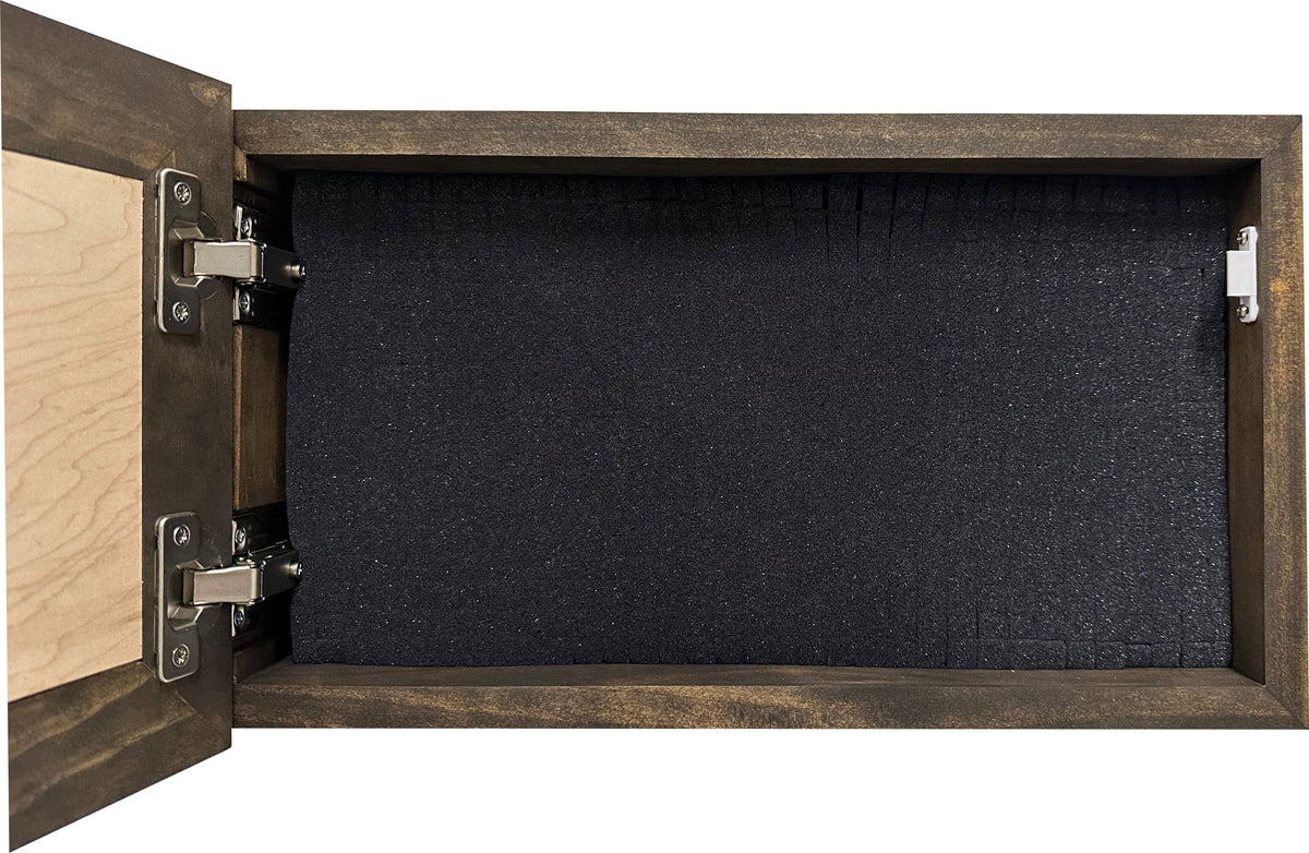 Open dark wood box with silver hinges and interior black pluck foam for equipment storage.