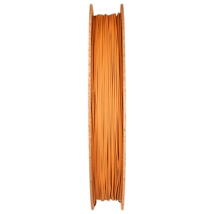 Side view of Copper Filamet spool showcasing orange copper filament with a transparent background