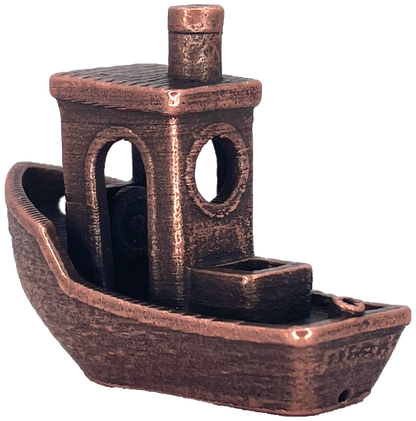 A metallic copper-colored 3D-printed tugboat figurine with textured surface details.