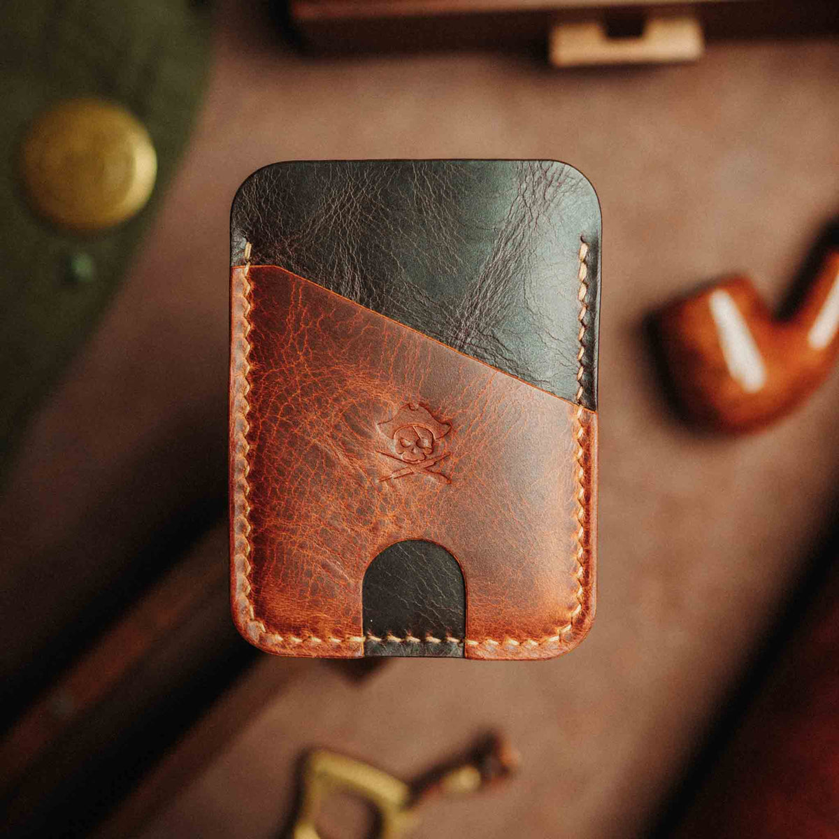 Front view of Pirate Goods Boatswain v4 Slim Wallet showcasing brown leather, black panel, card slots, and stitching