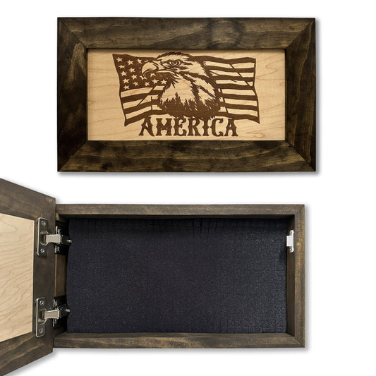 Dark wooden box with an engraved American flag, eagle, and "AMERICA" on the lid, revealing dark foam inside.