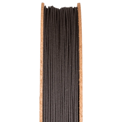 Front view of High Carbon Iron Filamet on a half-height cardboard spool showcasing dark filament