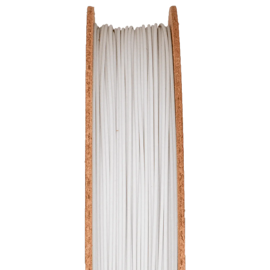Front view of Pyrex Borosilicate Glass Filamet spool showcasing white glass filament with cork sides on a dark background