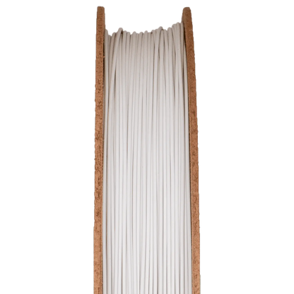 Close-up of Zirconium Silicate Ceramic Filamet spool showing white filament wound on a wooden spool