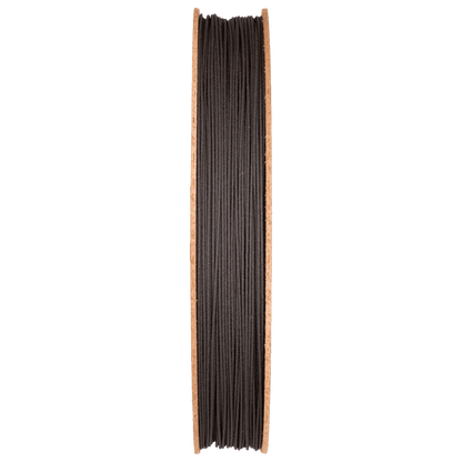 Front view of High Carbon Iron Filamet showcasing tightly wound dark filament on a wooden spool