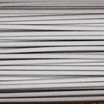 Close-up of Metal Filamet sample showcasing parallel metallic strands against a neutral background