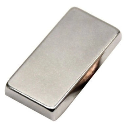 Angled view of N52 earth magnet from gold and silver jewelry acid test kit on white background