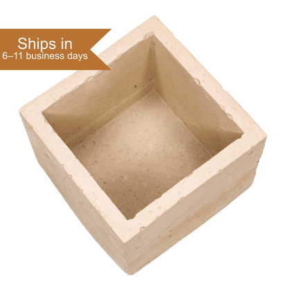 Angled view of a Sintering Crucible - Refractory Cement showing its deep square cavity, ships in 6 to 11 business days