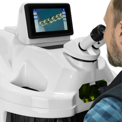Close-up of Tauweld 225J benchtop laser welder showing its microscope and touchscreen with a metal chain