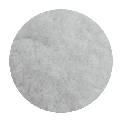 Close-up of Pickling Blend granules showcasing white pellets on a green background
