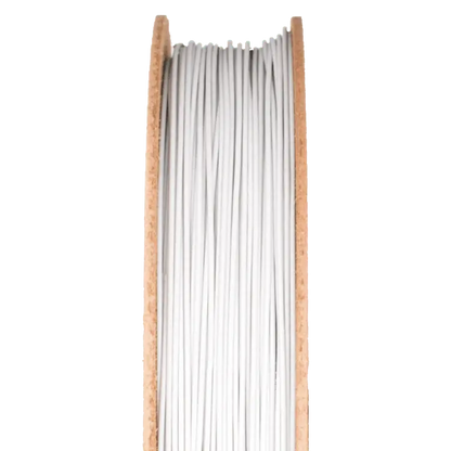 Front view of Porcelain Filamet spool showcasing white filament strands with a black background