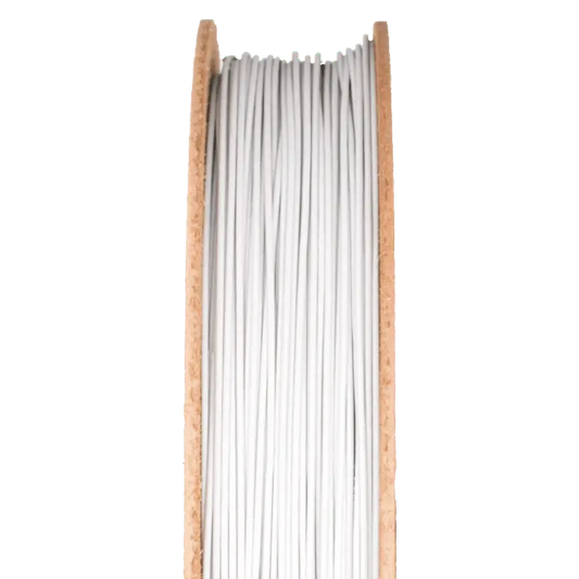 Front view of Porcelain Filamet spool showcasing white filament strands with a black background