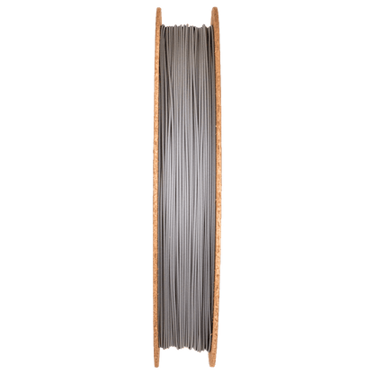 Front view of Titanium 64-23 Filamet filament spool showing gray filament wound between wooden-colored sides on a green background