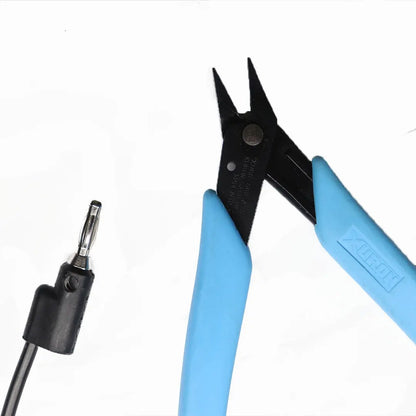 Close-up of Xuron grounded pliers for permanent jewelry welders showing blue handles, black jaws, and grounding lead on white background