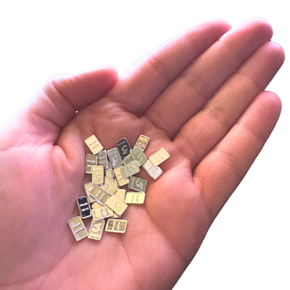 Close-up of the 1 lb .999 pure metal Walking Liberty Eagle bar showcasing gold, copper, and silver finishes in a hand