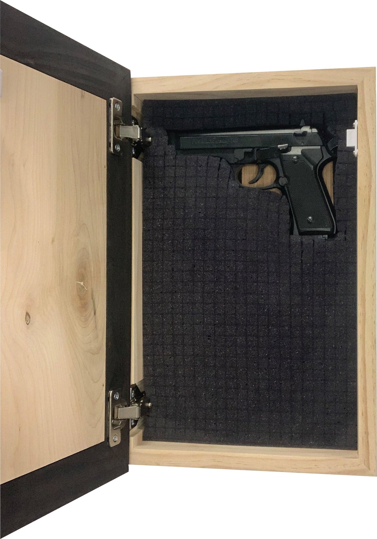 Open wooden concealment box with a black handgun inside, resting on a precut grid foam insert.