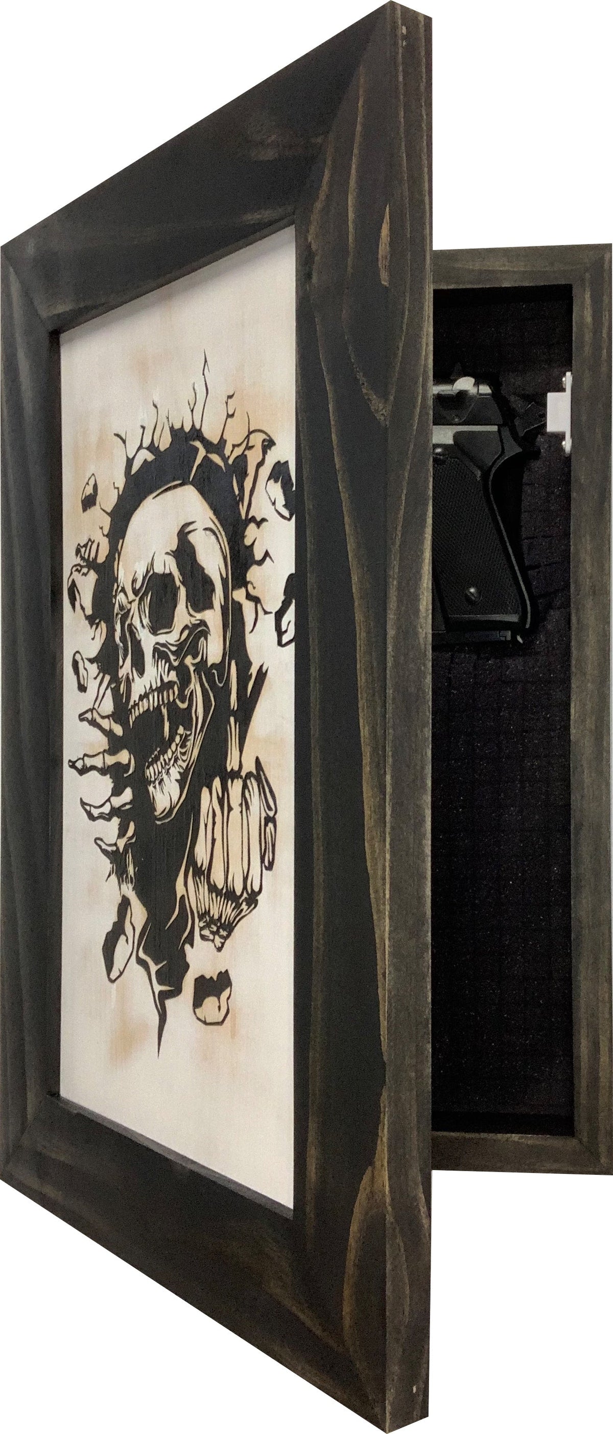 Dark wood wall safe disguised as a picture frame, with a skull graphic and hidden handgun compartment.