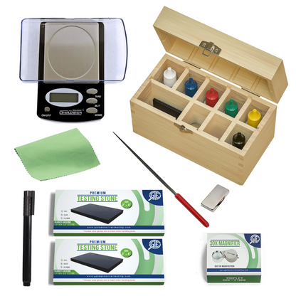 Overview of gold, silver and platinum testing kit with scale, acid bottles, testing stones, files and wooden storage box
