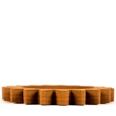Front view of Bronze Filamet showcasing its textured bronze-colored form against a white background