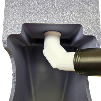 Close-up of Clean Up Buddy 12Volt conversion kit showing a white angled outlet pipe on a black sluice channel