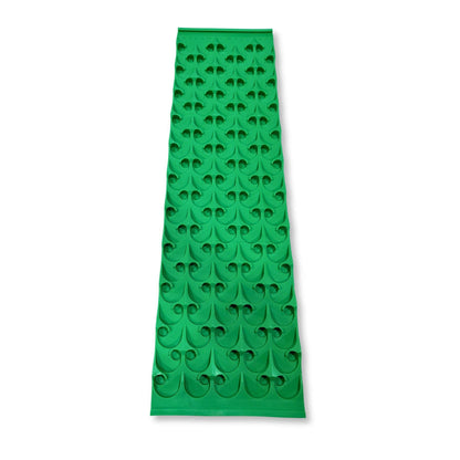 Front view of green 10X36 Sluice Mat - Dredge Dream Mat with repeating curved riffle pattern on white background